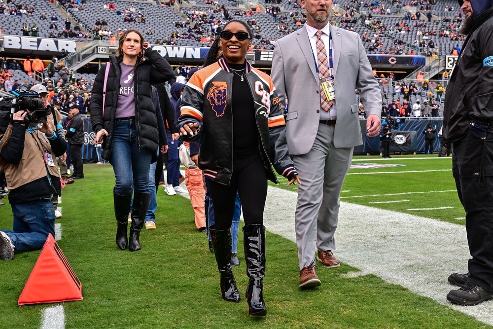 Nov 17, 2024; Chicago, Illinois, USA; United States gymnast Simone Biles looks on before the game between the Chicago Bears and Green Bay Packers at Soldier Field. Mandatory Credit: Daniel Bartel-Imagn Images