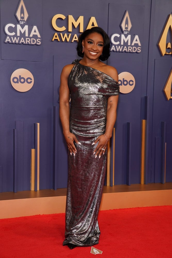 Simone Biles poses on the red carpet before the 58th Annual Country Music Association Awards in Nashville, Tenn., Wednesday, Nov. 20, 2024.