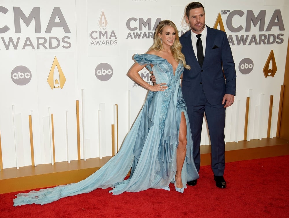 Nov 9, 2022; Nashville, Tennessee, USA; Carrie Underwood and Mike Fisher arrive for the 56th CMA Awards at Bridgestone Arena. Mandatory Credit: Andrew Nelles/The Tennessean-USA TODAY NETWORK