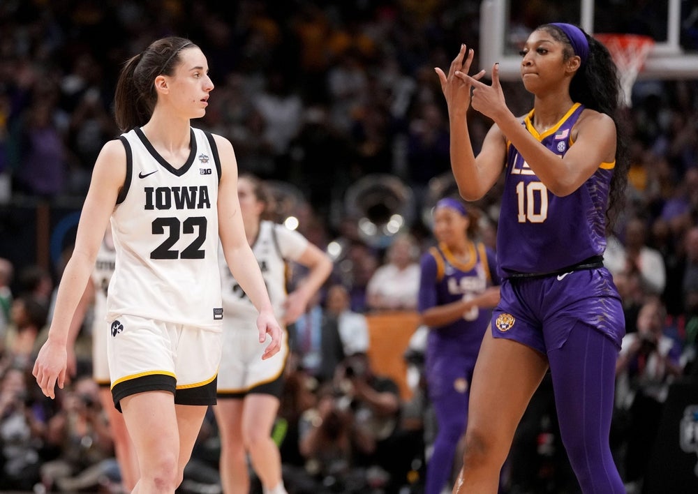 Angel Reese (10) shows Iowa Caitlin Clark her ring finger during the final seconds of the women's NCAA Tournament national championship game.
Syndication Hawkcentral
