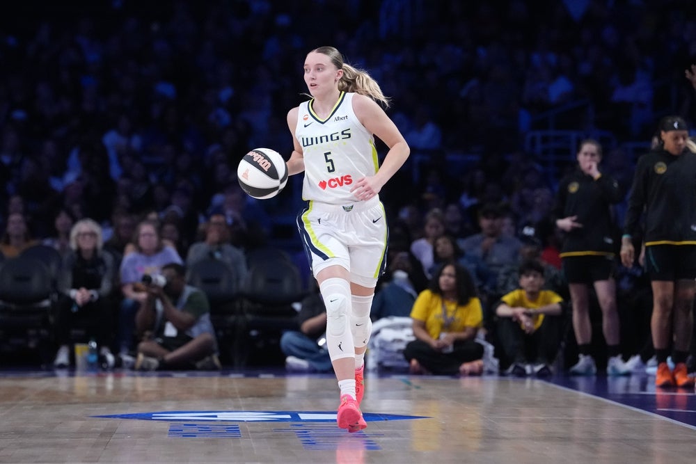 Jun 5, 2026; Los Angeles, California, USA; Dallas Wings guard Paige Bueckers (5) dribbles the ball against the LA Sparks in the second half at Crypto.com Arena. Mandatory Credit: Kirby Lee-Imagn Images