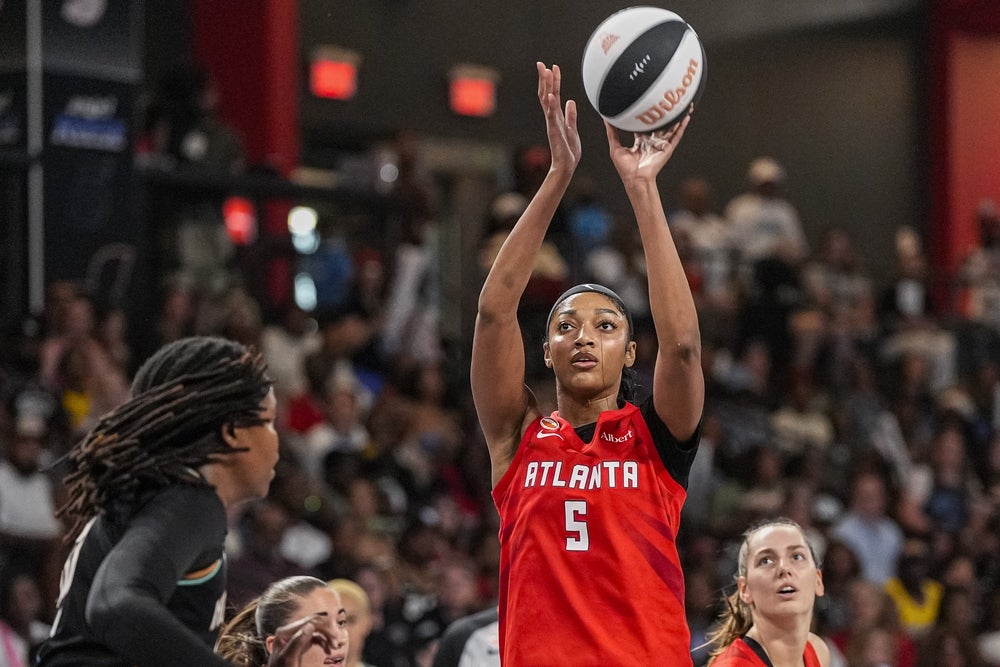 Jun 11, 2026; College Park, Georgia, USA; Atlanta Dream forward Angel Reese (5) shoots against the New York Liberty during the first half at Gateway Center Arena at College Park. Mandatory Credit: Dale Zanine-Imagn Images