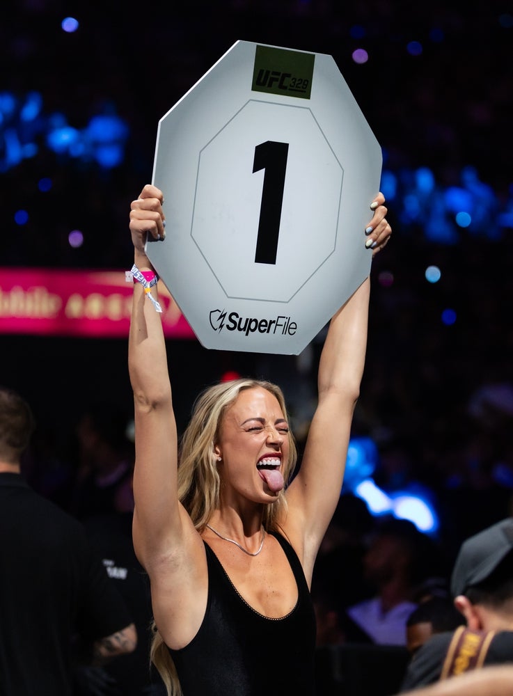 Jul 11, 2026; Las Vegas, Nevada, USA; Indiana Fever guard Sophie Cunningham works as a ring girl during UFC 329 at T-Mobile Arena. Mandatory Credit: Mark J. Rebilas-Imagn Images