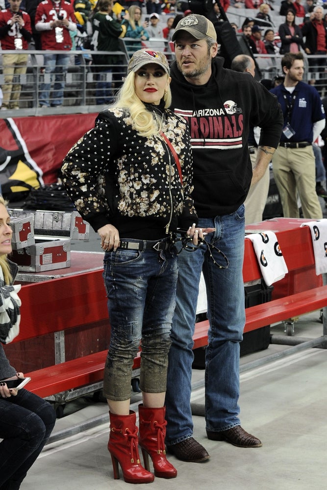 Dec 27, 2015; Glendale, AZ, USA; Recording artists Blake Shelton and Gwen Stefani attend the game between the Arizona Cardinals and the Green Bay Packers at University of Phoenix Stadium. Mandatory Credit: Joe Camporeale-Imagn Images