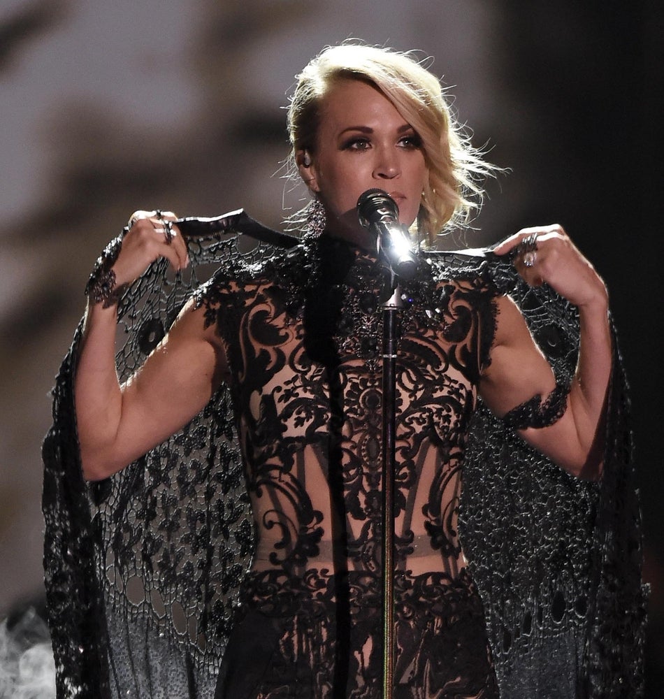 June 8, 2016; Nashville, TN, USA; Carrie Underwood removes her cape during the CMT Music Awards at Bridgestone Arena. Mandatory Credit: Larry McCormack/The Tennessean via USA TODAY NETWORK