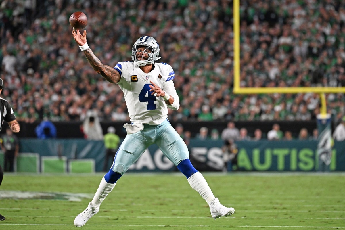 Sep 21, 2025; Chicago, Illinois, USA; Chicago Bears defensive end Montez Sweat (98) and defensive tackle Gervon Dexter Sr. (99) after sacking Dallas Cowboys quarterback Dak Prescott (not pictured) during the second half at Soldier Field. Mandatory Credit: David Banks-Imagn Images