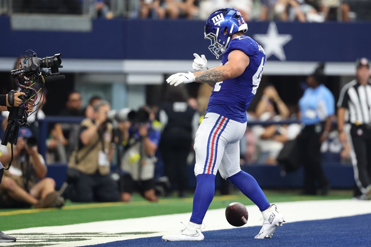 Sep 14, 2025; Arlington, Texas, USA; New York Giants running back Cam Skattebo (44) reacts after scoring a touchdown against the Dallas Cowboys during the fourth quarter at AT&T Stadium. Mandatory Credit: Kevin Jairaj-Imagn Images