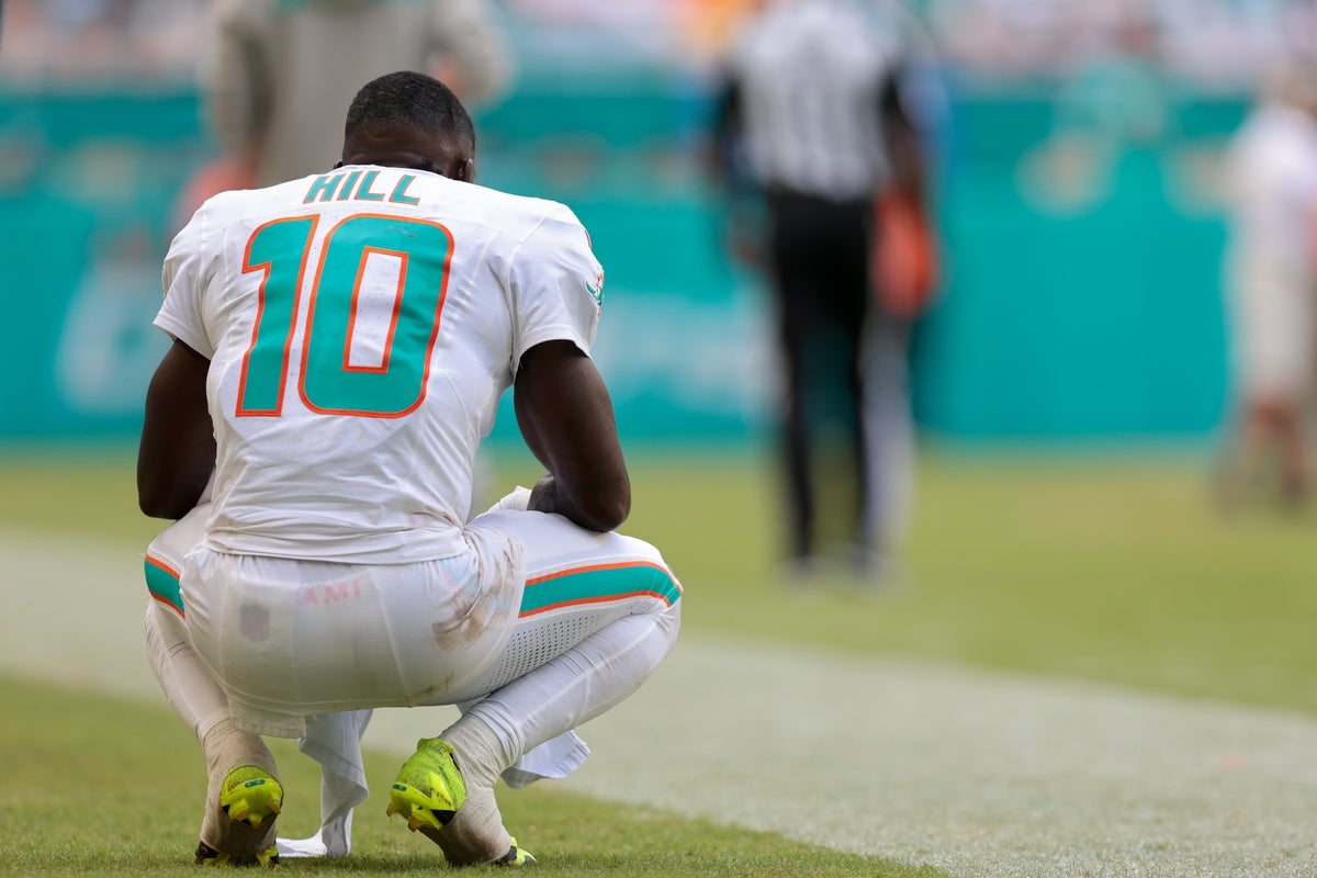 Sep 14, 2025; Miami Gardens, Florida, USA; Miami Dolphins wide receiver Tyreek Hill (10) watches from the sideline against the New England Patriots during the fourth quarter at Hard Rock Stadium. Mandatory Credit: Sam Navarro-Imagn Images
