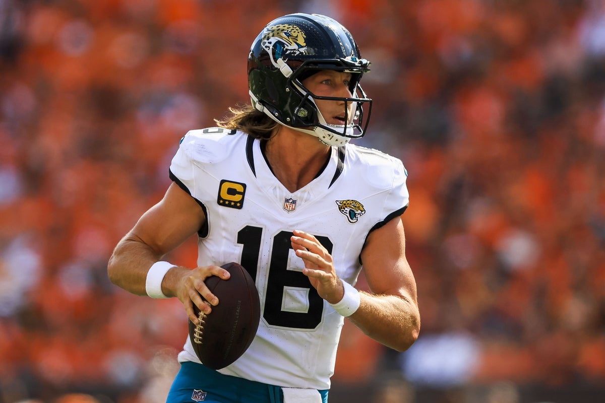 Sep 14, 2025; Cincinnati, Ohio, USA; Jacksonville Jaguars quarterback Trevor Lawrence (16) runs with the ball against the Cincinnati Bengals in the second half at Paycor Stadium. Mandatory Credit: Katie Stratman-Imagn Images