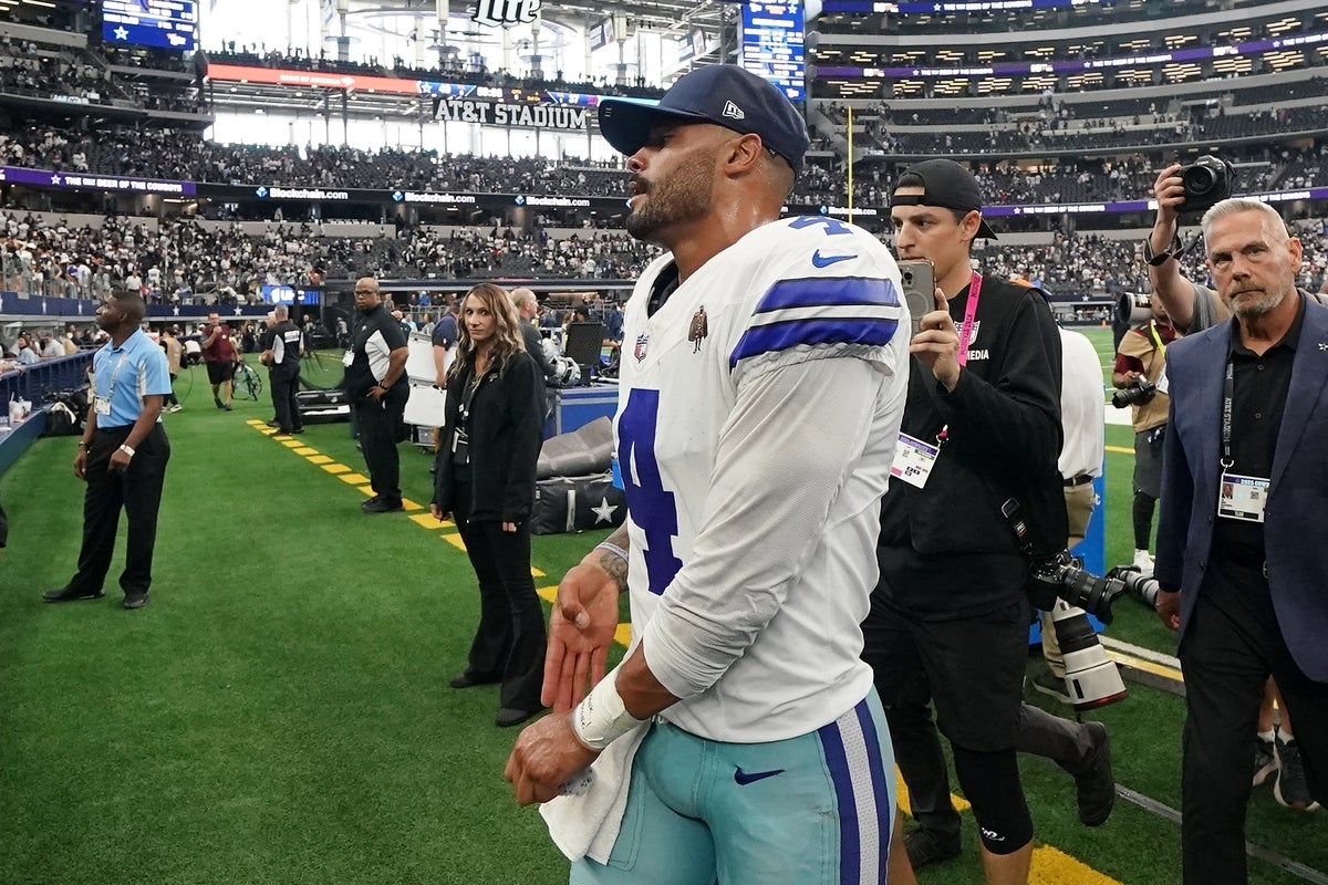 Sep 14, 2025; Arlington, Texas, USA; Dallas Cowboys quarterback Dak Prescott (4) walks off the field after the game against the New York Giants at AT&T Stadium. Mandatory Credit: Raymond Carlin III-Imagn Images
