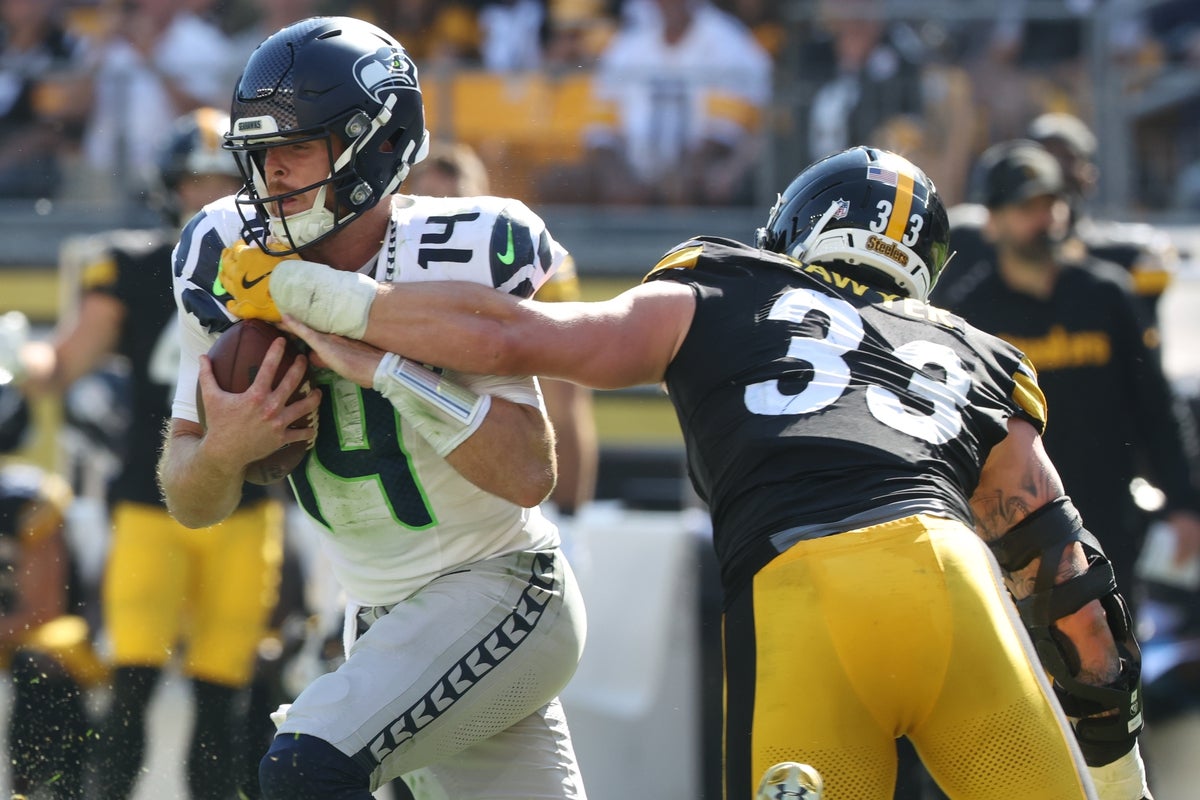 Sep 14, 2025; Pittsburgh, Pennsylvania, USA;  Pittsburgh Steelers linebacker Jack Sawyer (33) sacks Seattle Seahawks quarterback Sam Darnold (14) during the fourth quarter at Acrisure Stadium. Mandatory Credit: Charles LeClaire-Imagn Images