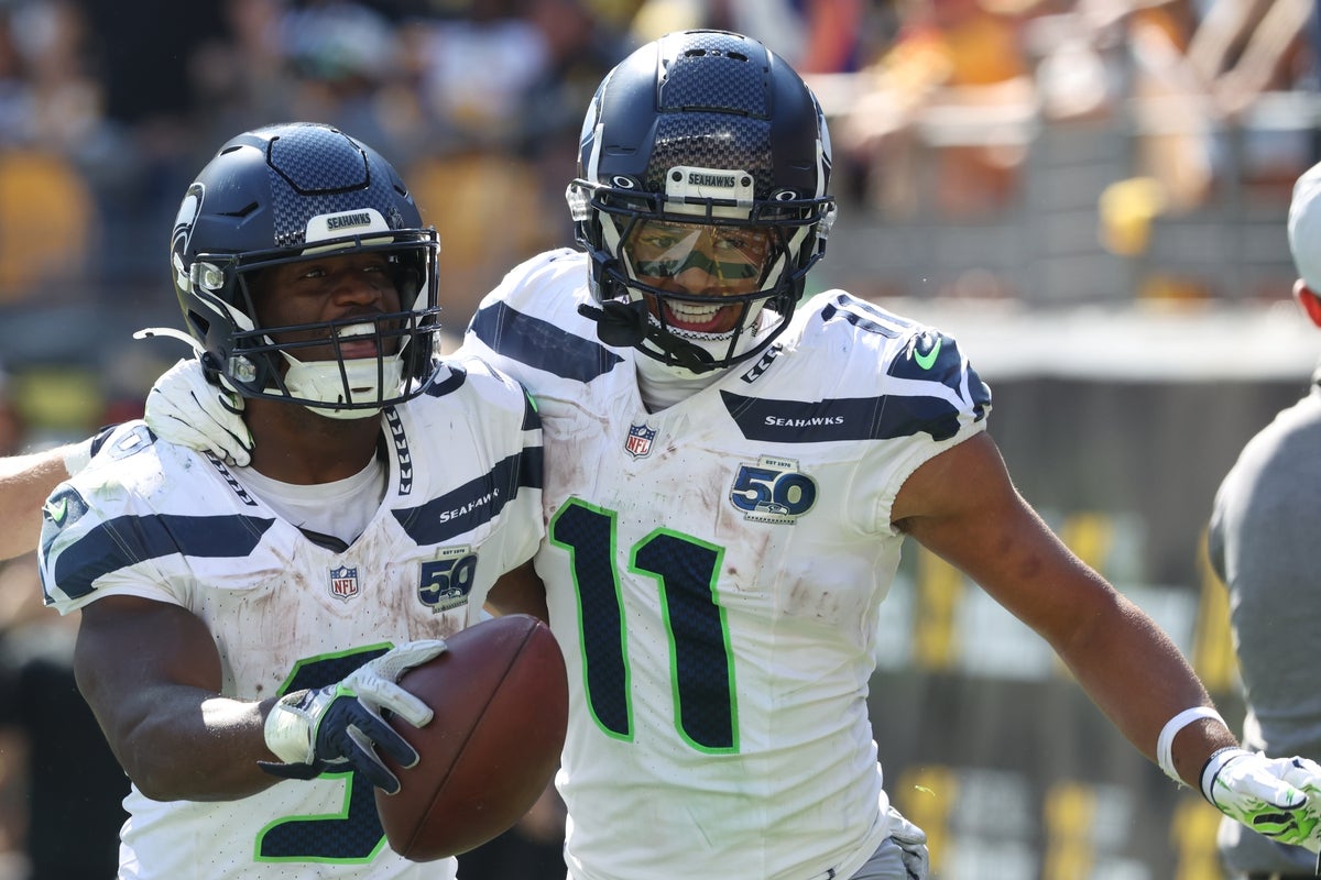Sep 14, 2025; Pittsburgh, Pennsylvania, USA; Seattle Seahawks running back Kenneth Walker III (9) celebrates his touchdown with wide receiver Jaxon Smith-Njigba (11) against the Pittsburgh Steelers during the fourth quarter at Acrisure Stadium. Mandatory Credit: Charles LeClaire-Imagn Images