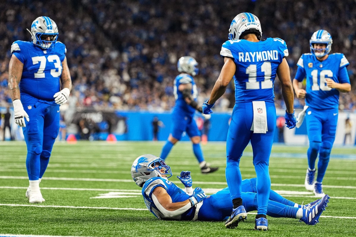 Detroit Lions wide receiver Amon-Ra St. Brown (14), center left, celebrates scoring a touchdown against Chicago Bears during the second half at Ford Field in Detroit on Sunday, Sept. 14, 2025.