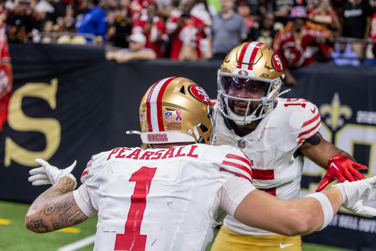 Sep 14, 2025; New Orleans, Louisiana, USA; San Francisco 49ers wide receiver Jauan Jennings (15) celebrates with wide receiver Ricky Pearsall (1) after scoring a touchdown against the New Orleans Saints during the second half at Caesars Superdome. Mandatory Credit: Stephen Lew-Imagn Images