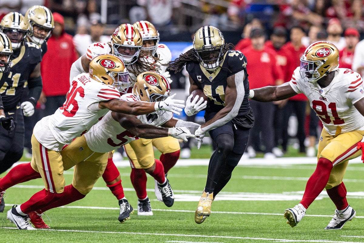 Sep 14, 2025; New Orleans, Louisiana, USA; New Orleans Saints running back Alvin Kamara (41) runs against the San Francisco 49ers defense during the second half at Caesars Superdome. Mandatory Credit: Stephen Lew-Imagn Images