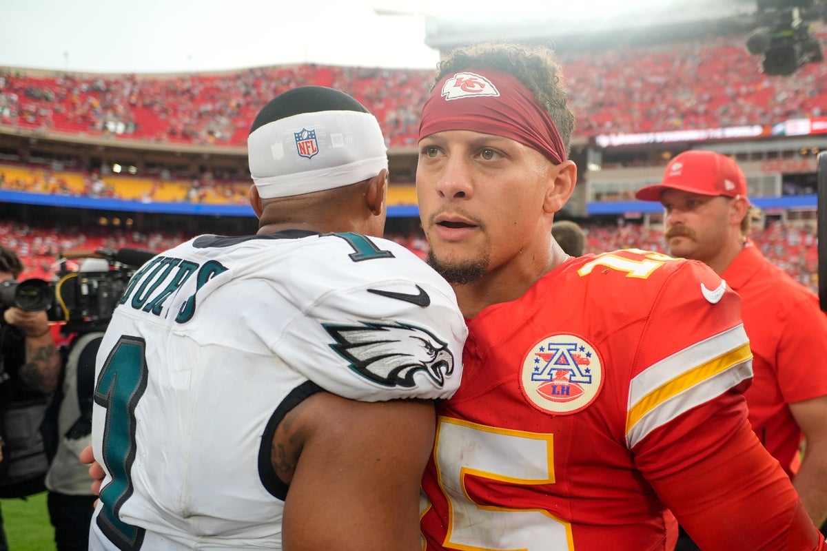 Sep 14, 2025; Kansas City, Missouri, USA; Philadelphia Eagles quarterback Jalen Hurts (1) and Kansas City Chiefs quarterback Patrick Mahomes (15) greet eachother after the game at GEHA Field at Arrowhead Stadium. Mandatory Credit: Jay Biggerstaff-Imagn Images