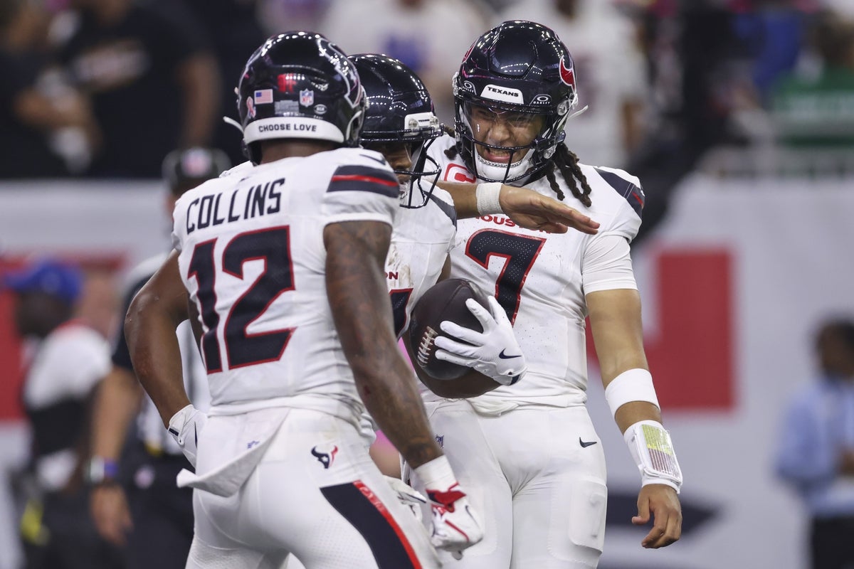 Sep 15, 2025; Houston, Texas, USA; Houston Texans quarterback C.J. Stroud (7) celebrates with running back Nick Chubb (21) after Chubb scores a touchdown during the fourth quarter against the Tampa Bay Buccaneers at NRG Stadium. Mandatory Credit: Troy Taormina-Imagn Images