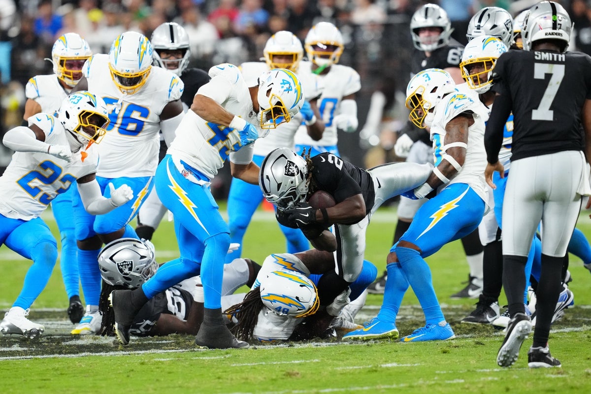 Sep 15, 2025; Paradise, Nevada, USA; Las Vegas Raiders running back Ashton Jeanty (2) rushes the ball during the second quarter against the Los Angeles Chargers at Allegiant Stadium. Mandatory Credit: Stephen R. Sylvanie-Imagn Images