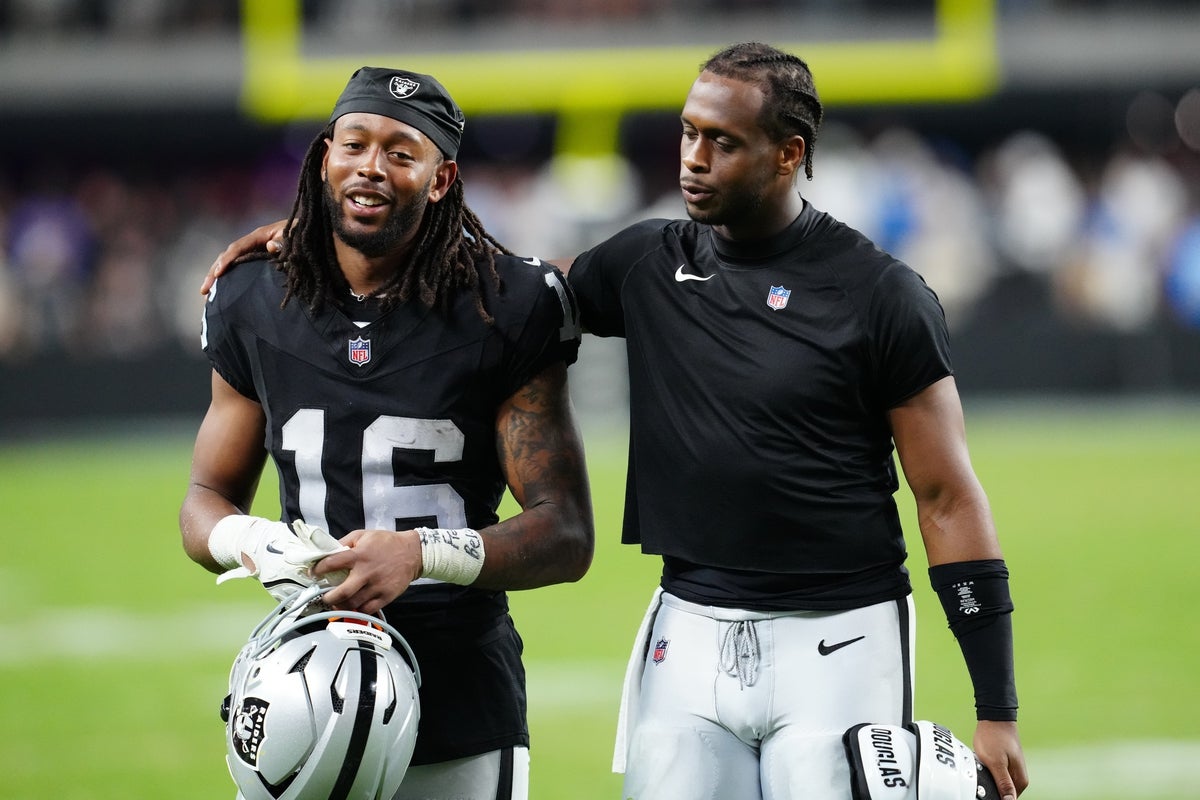 Sep 15, 2025; Paradise, Nevada, USA;  Las Vegas Raiders wide receiver Jakobi Meyers (16) and Las Vegas Raiders quarterback Geno Smith (7) walk off the field after the game at Allegiant Stadium. Mandatory Credit: Stephen R. Sylvanie-Imagn Images