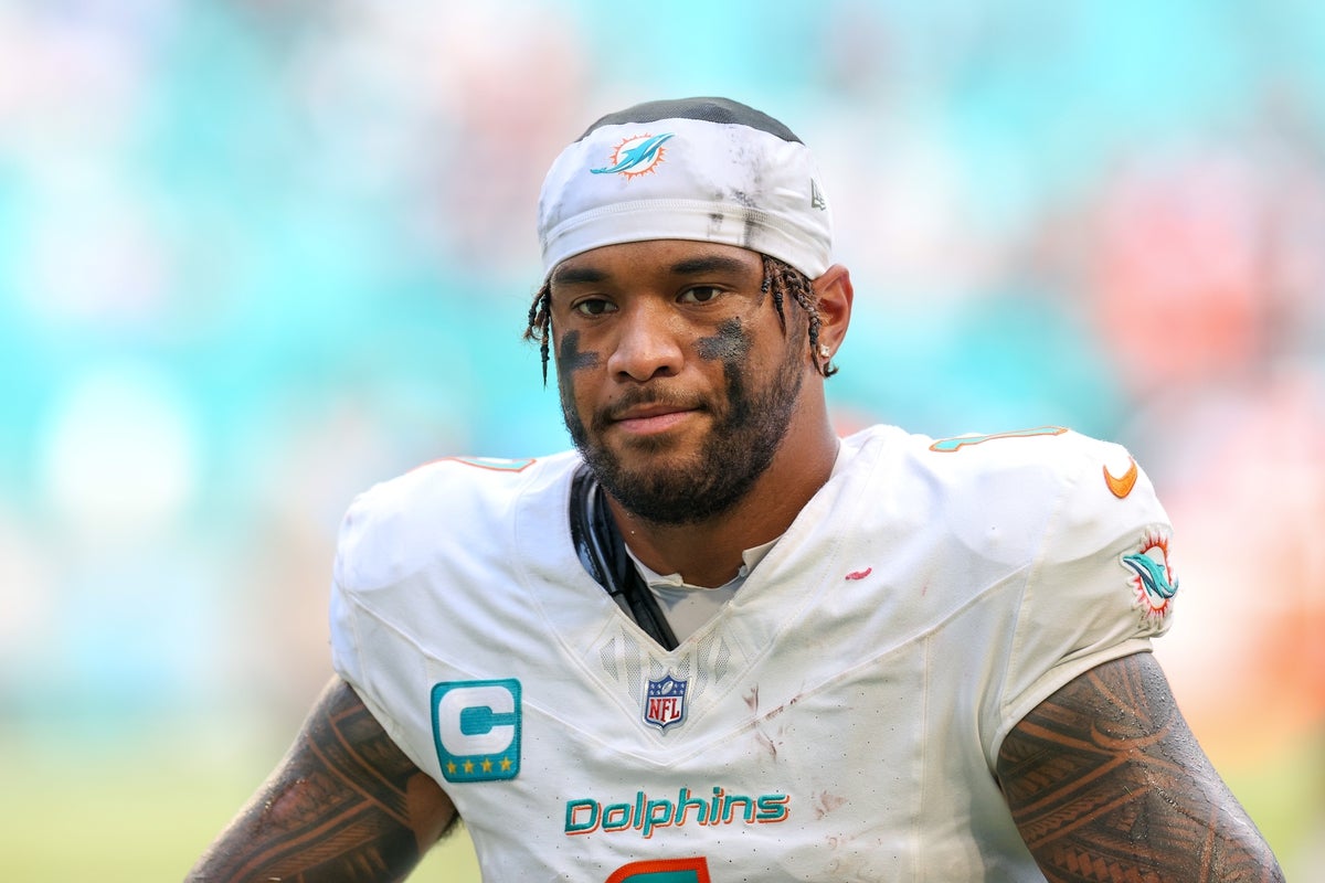 Sep 14, 2025; Miami Gardens, Florida, USA; Miami Dolphins quarterback Tua Tagovailoa (1) looks on after game against the New England Patriots at Hard Rock Stadium. Mandatory Credit: Nathan Ray Seebeck-Imagn Images