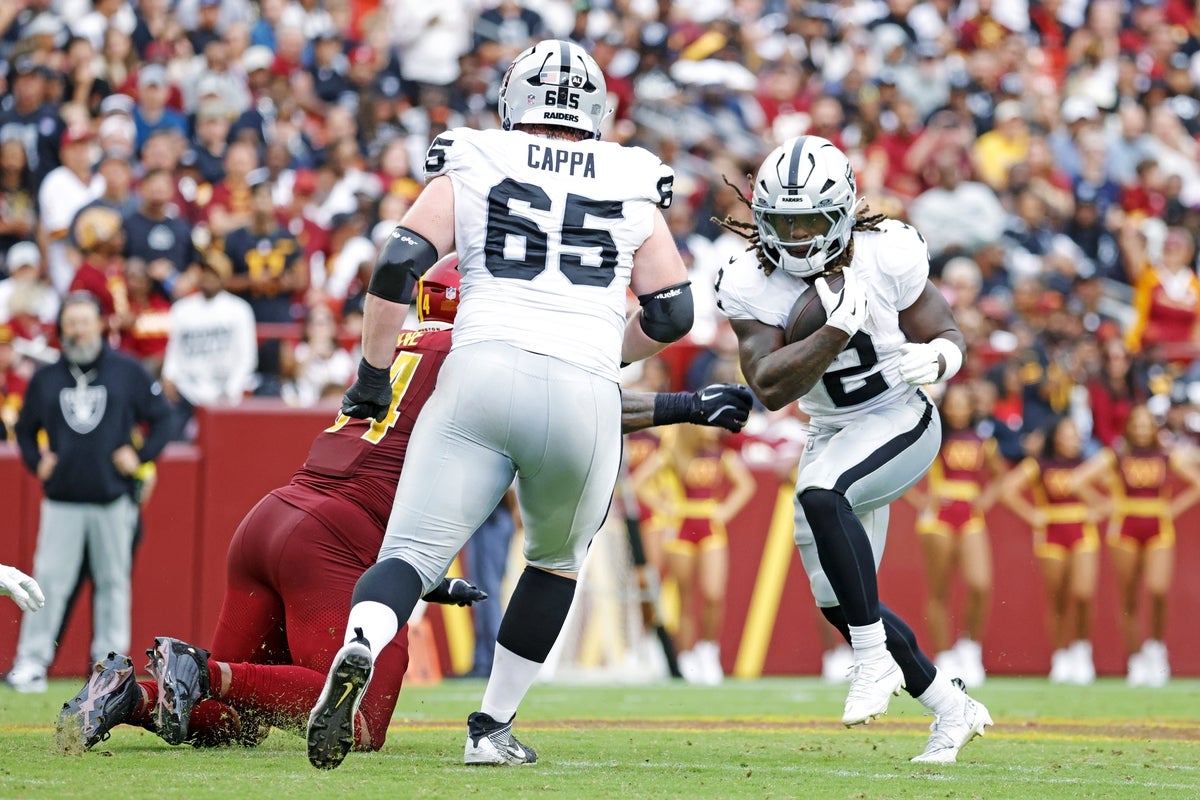 Sep 21, 2025; Landover, Maryland, USA; Las Vegas Raiders running back Ashton Jeanty (2) runs the ball during the second half against the Washington Commanders at Northwest Stadium. Mandatory Credit: Amber Searls-Imagn Images