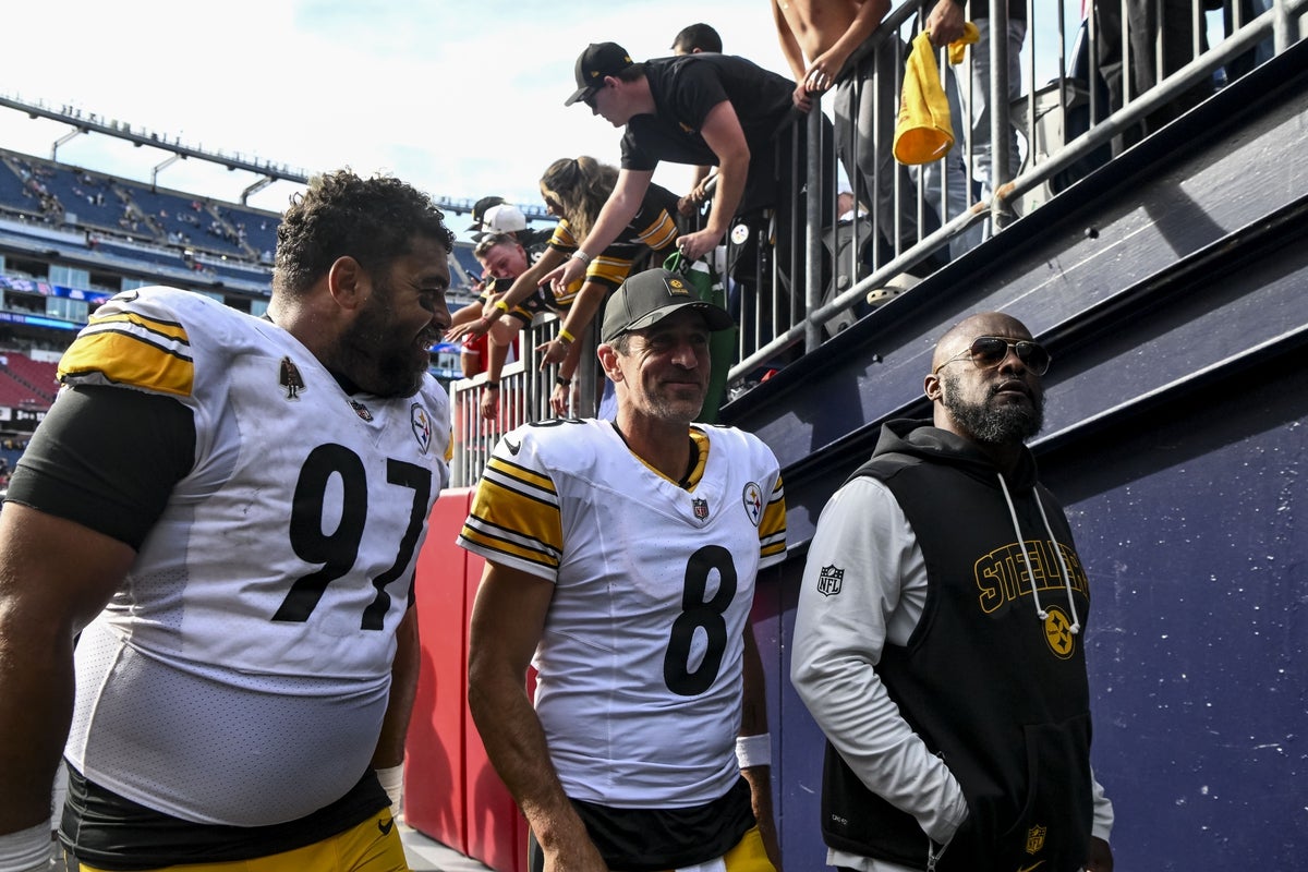 Sep 21, 2025; Foxborough, Massachusetts, USA; Pittsburgh Steelers defensive tackle Cameron Heyward (97) and Pittsburgh Steelers quarterback Aaron Rodgers (8) after the game at Gillette Stadium. Mandatory Credit: Brian Fluharty-Imagn Images