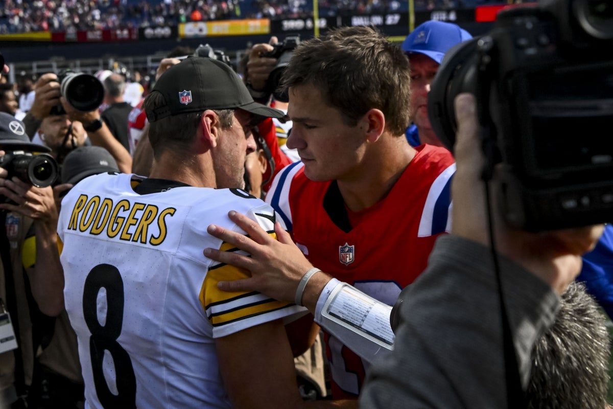 Sep 21, 2025; Foxborough, Massachusetts, USA; Pittsburgh Steelers quarterback Aaron Rodgers (8) and New England Patriots quarterback Drake Maye (10) after the game at Gillette Stadium. Mandatory Credit: Brian Fluharty-Imagn Images