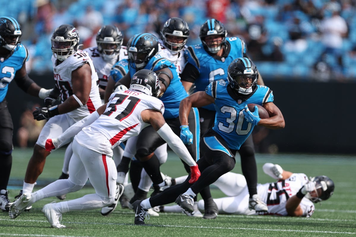 Sep 21, 2025; Charlotte, North Carolina, USA; Carolina Panthers running back Chuba Hubbard (30) carries the ball during the second half against the Atlanta Falcons at Bank of America Stadium. Mandatory Credit: Cory Knowlton-Imagn Images