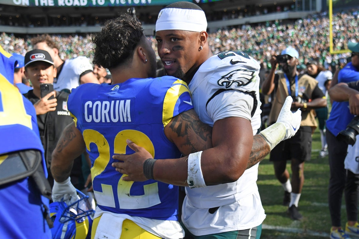 Sep 21, 2025; Philadelphia, Pennsylvania, USA; Los Angeles Rams running back Kyren Williams (23) and Philadelphia Eagles running back Saquon Barkley (26) after the game at Lincoln Financial Field. Mandatory Credit: Eric Hartline-Imagn Images