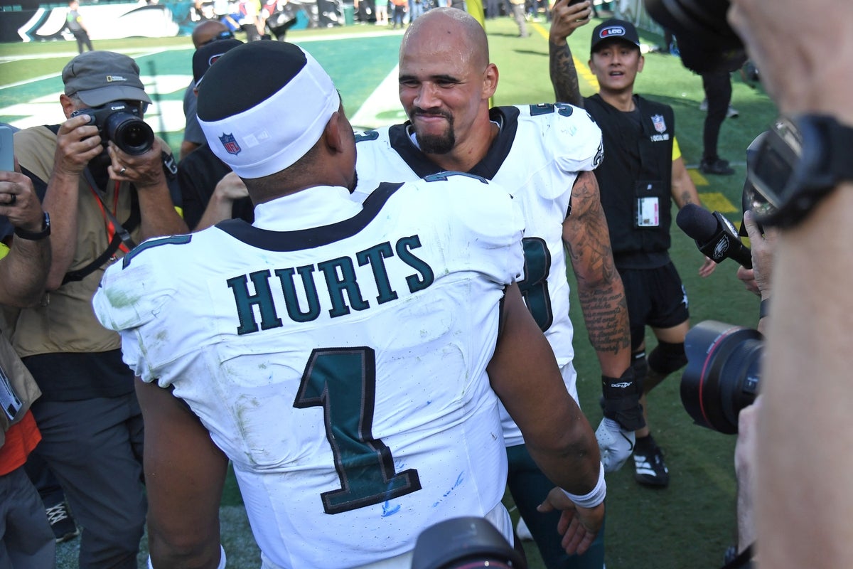 Sep 21, 2025; Philadelphia, Pennsylvania, USA; Philadelphia Eagles quarterback Jalen Hurts (1) and  linebacker Zack Baun (53) after win against the Los Angeles Rams at Lincoln Financial Field. Mandatory Credit: Eric Hartline-Imagn Images
