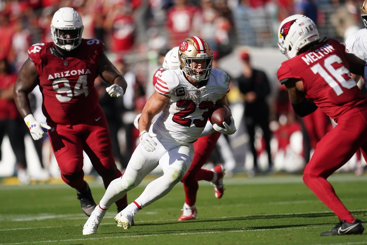 Sep 21, 2025; Santa Clara, California, USA; San Francisco 49ers running back Christian McCaffrey (23) carries the ball against the Arizona Cardinals during the second half at Levi