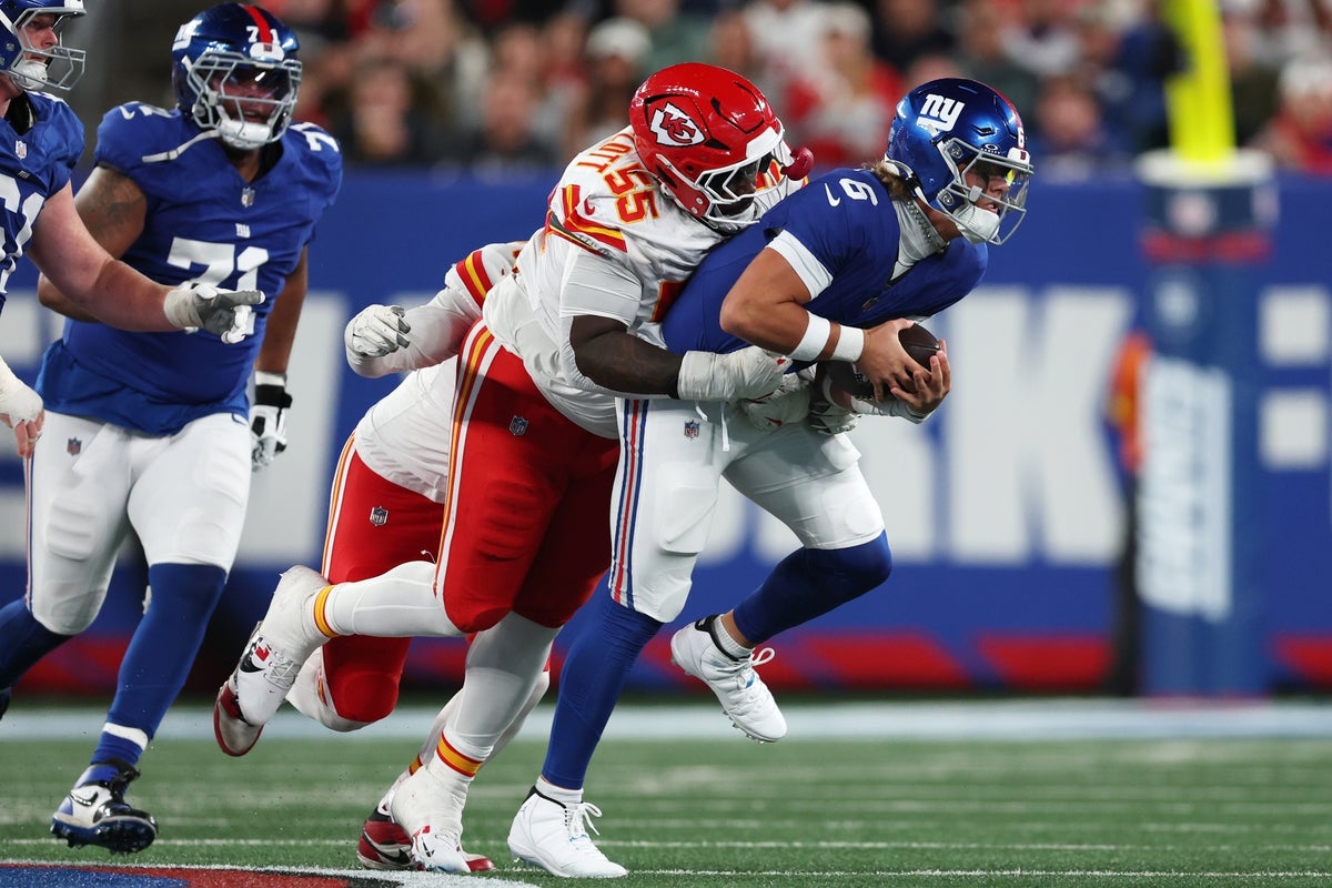 Sep 21, 2025; East Rutherford, New Jersey, USA; New York Giants quarterback Jaxson Dart (6) runs against Kansas City Chiefs defensive tackle Omarr Norman-Lott (55) in the third quarter at MetLife Stadium. Mandatory Credit: Vincent Carchietta-Imagn Images