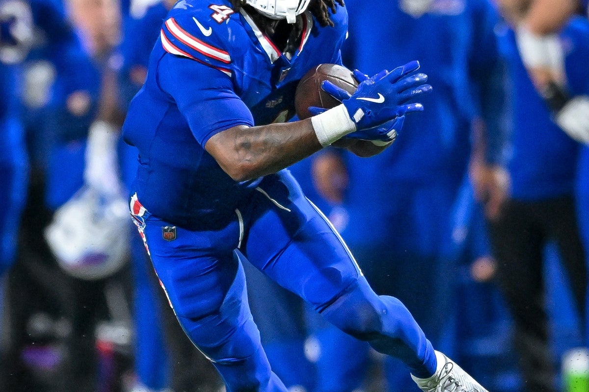 Sep 18, 2025; Orchard Park, New York, USA; Buffalo Bills running back James Cook (4) carries the ball in the fourth quarter against the Miami Dolphins at Highmark Stadium. Mandatory Credit: Mark Konezny-Imagn Images