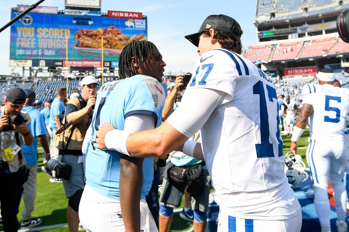 Sep 21, 2025; Nashville, Tennessee, USA; Indianapolis Colts quarterback Daniel Jones (17) talks with Tennessee Titans quarterback Cameron Ward (1) during post game at Nissan Stadium. Mandatory Credit: Steve Roberts-Imagn Images