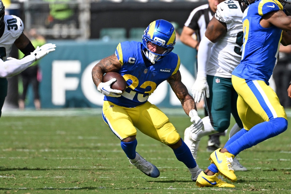 Sep 21, 2025; Philadelphia, Pennsylvania, USA; Los Angeles Rams running back Kyren Williams (23) and Philadelphia Eagles running back Saquon Barkley (26) after the game at Lincoln Financial Field. Mandatory Credit: Eric Hartline-Imagn Images