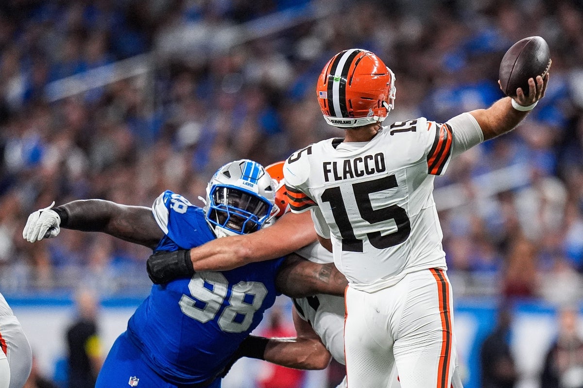 Detroit Lions defensive tackle DJ Reader (98) tries to tackle Cleveland Browns quarterback Joe Flacco (15) during the second half at Ford Field in Detroit on Sunday, Sept. 28, 2025.