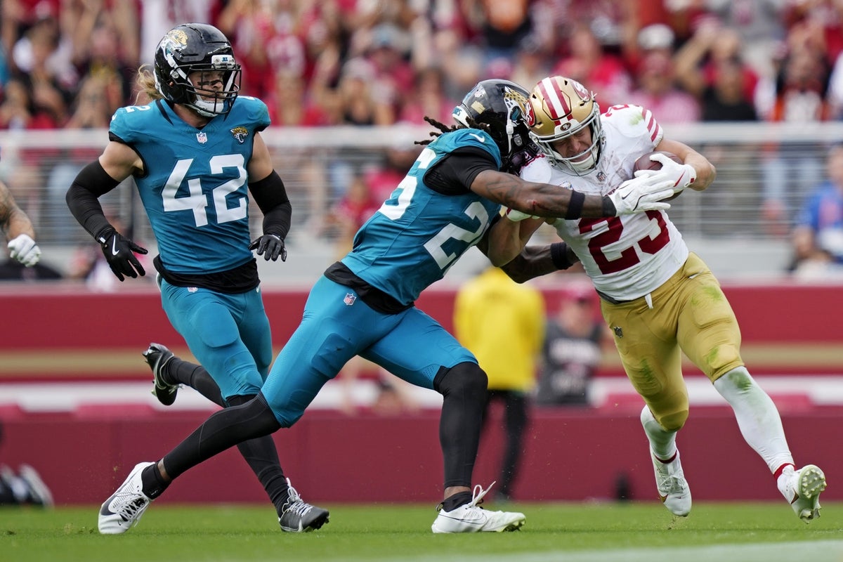 Sep 28, 2025; Santa Clara, California, USA; San Francisco 49ers running back Christian McCaffrey (23) runs the ball during the second half against the Jacksonville Jaguars at Levi
