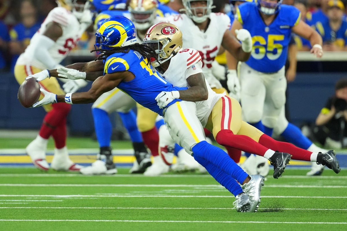 Oct 2, 2025; Inglewood, California, USA; Los Angeles Rams wide receiver Davante Adams (17) makes a catch against San Francisco 49ers cornerback Renardo Green (0) during the first half at SoFi Stadium. Mandatory Credit: Kirby Lee-Imagn Images