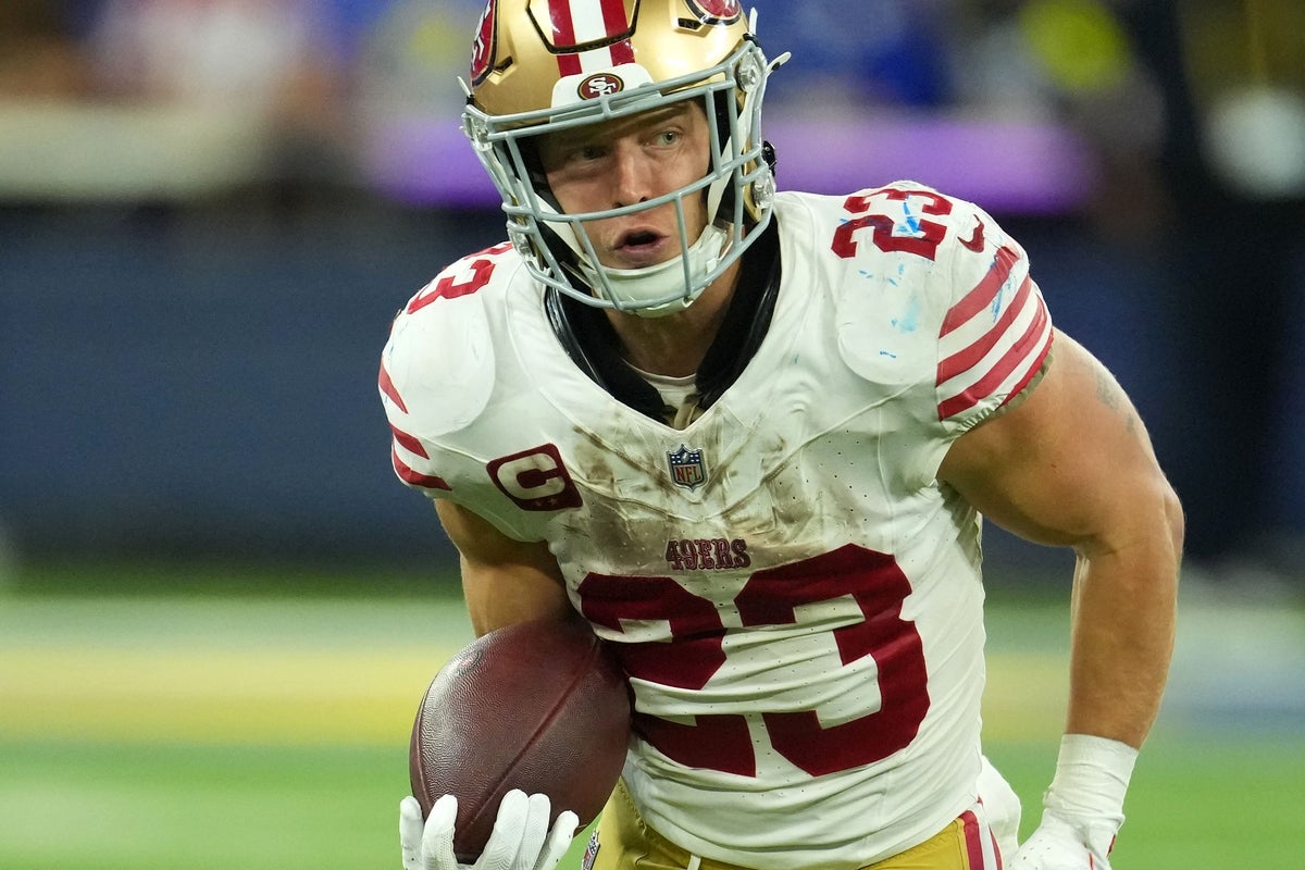 Oct 2, 2025; Inglewood, California, USA; San Francisco 49ers running back Christian McCaffrey (23) rushes the ball against the Los Angeles Rams during the second half at SoFi Stadium. Mandatory Credit: Kirby Lee-Imagn Images