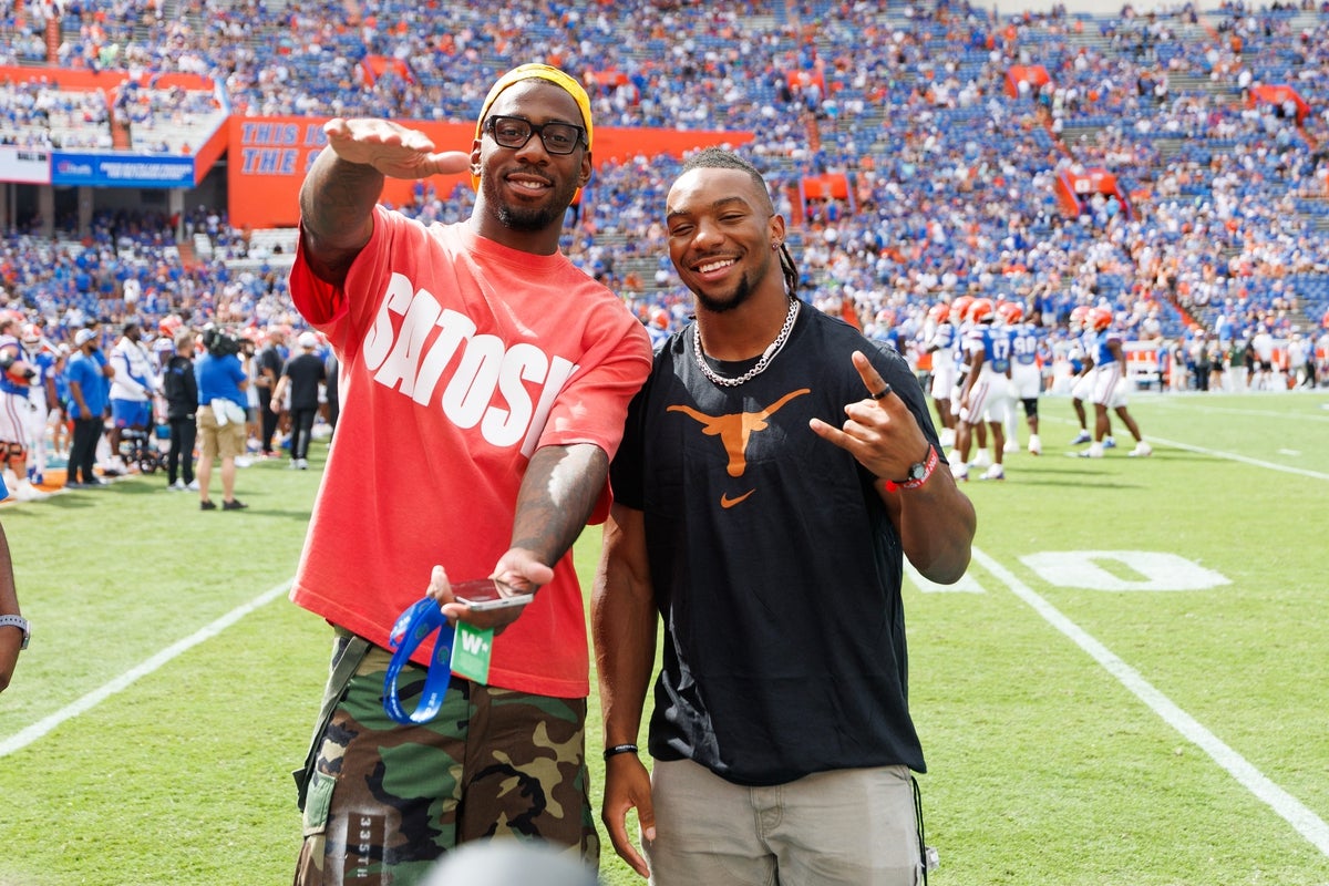 Oct 4, 2025; Gainesville, Florida, USA; Atlanta Falcons tight end Kyle Pitts (8) and Atlanta Falcons running back Bijan Robinson (7) gesture before a game between the Florida Gators and Texas Longhorns at Ben Hill Griffin Stadium. Mandatory Credit: Matt Pendleton-Imagn Images