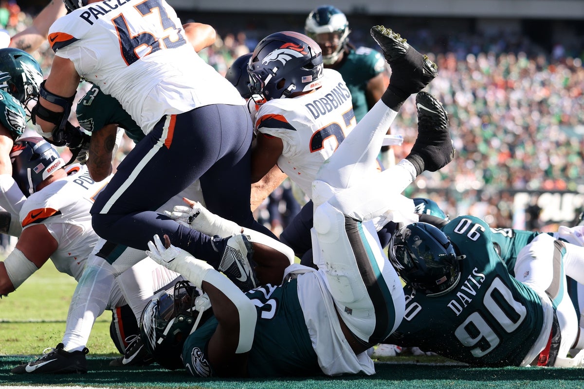 Oct 5, 2025; Philadelphia, Pennsylvania, USA; Denver Broncos running back J.K. Dobbins (27) scores a touchdown against the Philadelphia Eagles in the fourth quarter at Lincoln Financial Field. Mandatory Credit: Bill Streicher-Imagn Images