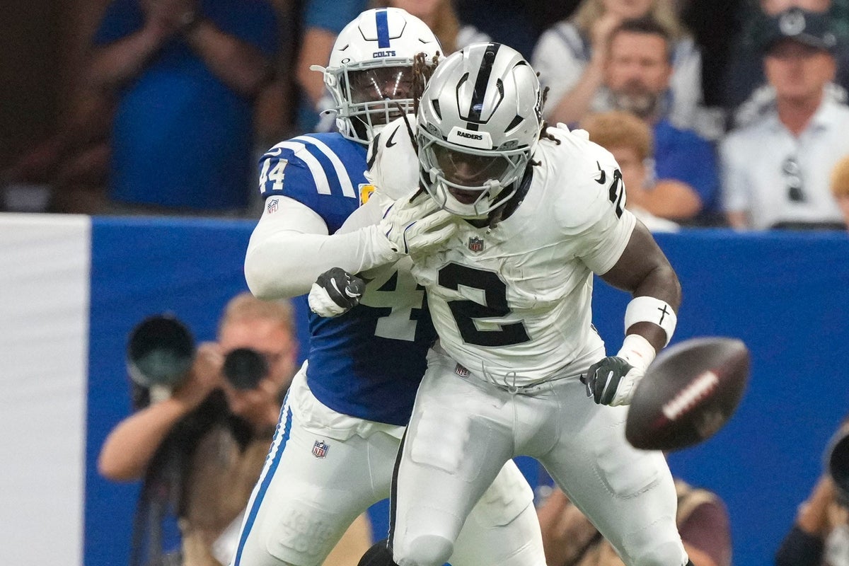 Indianapolis Colts linebacker Zaire Franklin (44) brings down Las Vegas Raiders running back Ashton Jeanty (2) as he misses a pass Sunday, Oct. 5, 2025, during a game at Lucas Oil Stadium in Indianapolis. The Colts defeated the Raiders 40-6.