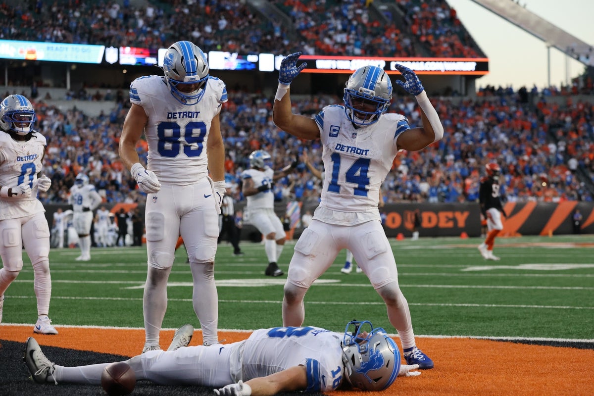 Oct 5, 2025; Cincinnati, Ohio, USA; Detroit Lions wide receiver Isaac Teslaa (18) celebrates a touchdown with tight end Brock Wright (89) and wide receiver Amon-Ra St. Brown (14) during the fourth quarter against the Cincinnati Bengals at Paycor Stadium. Mandatory Credit: Joseph Maiorana-Imagn Images