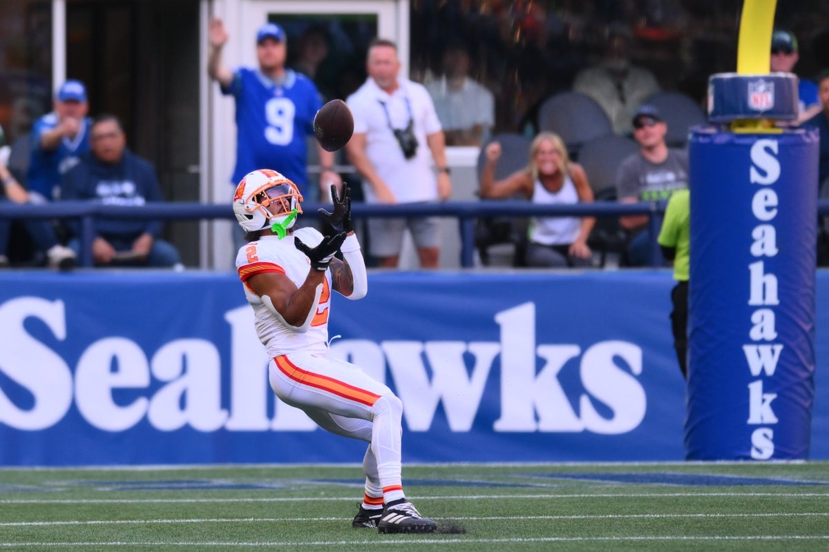 Oct 5, 2025; Seattle, Washington, USA; Tampa Bay Buccaneers wide receiver Emeka Egbuka (2) makes a catch during the second half against the Seattle Seahawks at Lumen Field. Mandatory Credit: Steven Bisig-Imagn Images