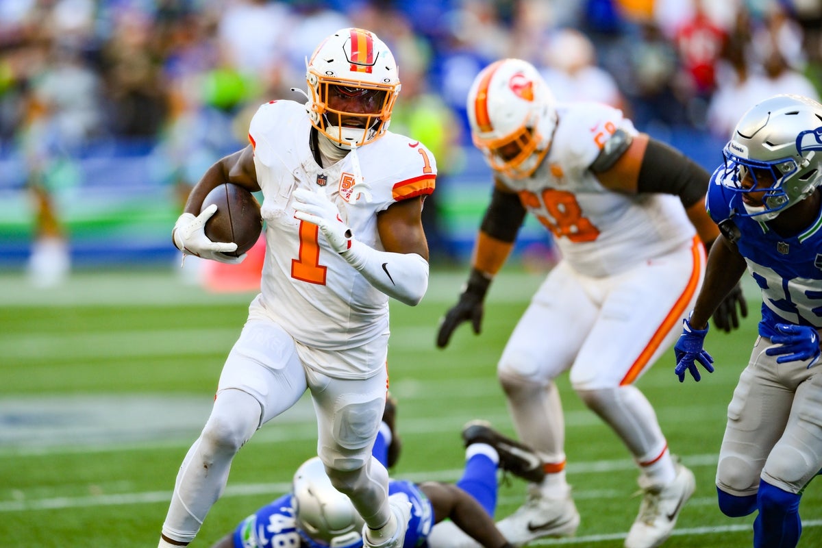 Oct 5, 2025; Seattle, Washington, USA;  Tampa Bay Buccaneers running back Rachaad White (1) carries the ball against the Seattle Seahawks during the second half at Lumen Field. Mandatory Credit: Steven Bisig-Imagn Images