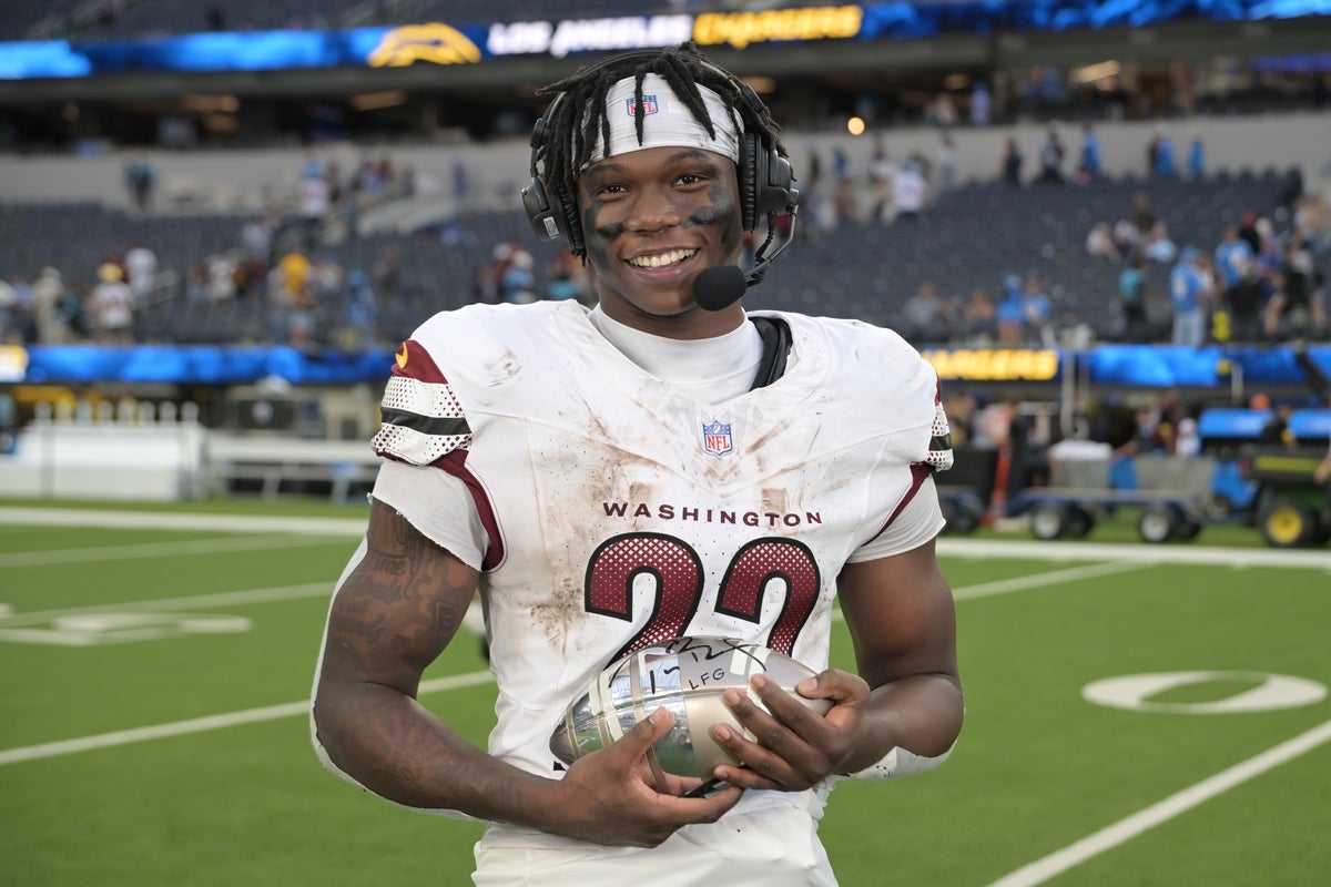 Oct 5, 2025; Inglewood, California, USA; Washington Commanders running back Jacory Croskey-Merritt (22) is interviewed after the game against the Los Angeles Chargers at SoFi Stadium. Mandatory Credit: Jayne Kamin-Oncea-Imagn Images