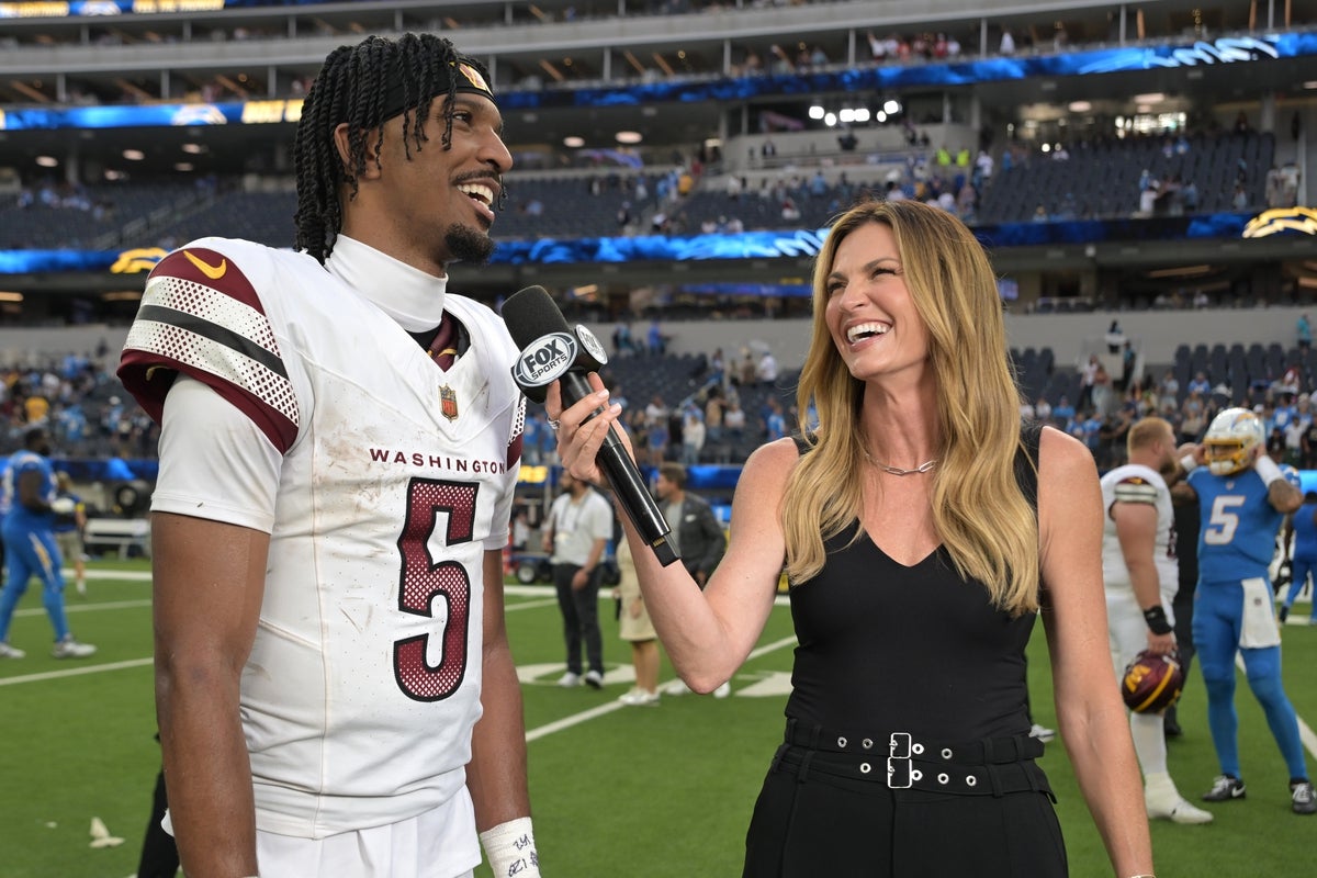 Oct 5, 2025; Inglewood, California, USA; FOX sideline reporter Erin Andrews interviews Washington Commanders quarterback Jayden Daniels (5) after the game against the Los Angeles Chargers at SoFi Stadium. Mandatory Credit: Jayne Kamin-Oncea-Imagn Images