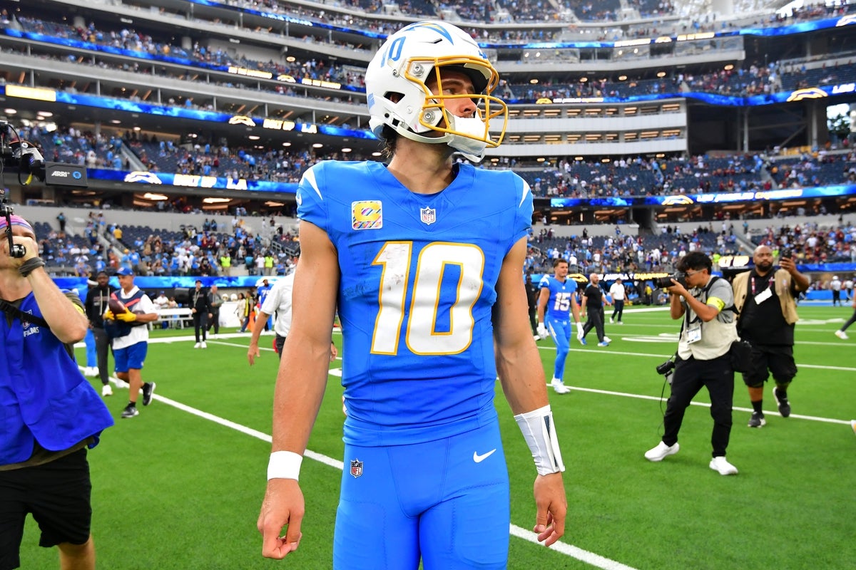 Oct 5, 2025; Inglewood, California, USA; Los Angeles Chargers quarterback Justin Herbert (10) reacts after the game against the Washington Commanders at SoFi Stadium. Mandatory Credit: Gary A. Vasquez-Imagn Images