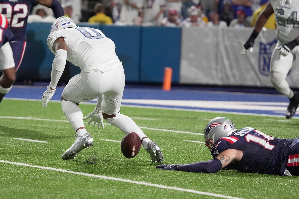 Buffalo Bills wide receiver Keon Coleman fumbles the ball while being pursued by New England Patriots linebacker Robert Spillane during first half action at Highmark Stadium in Orchard Park on Oct. 5, 2025. The Patriots recovered the fumble.
