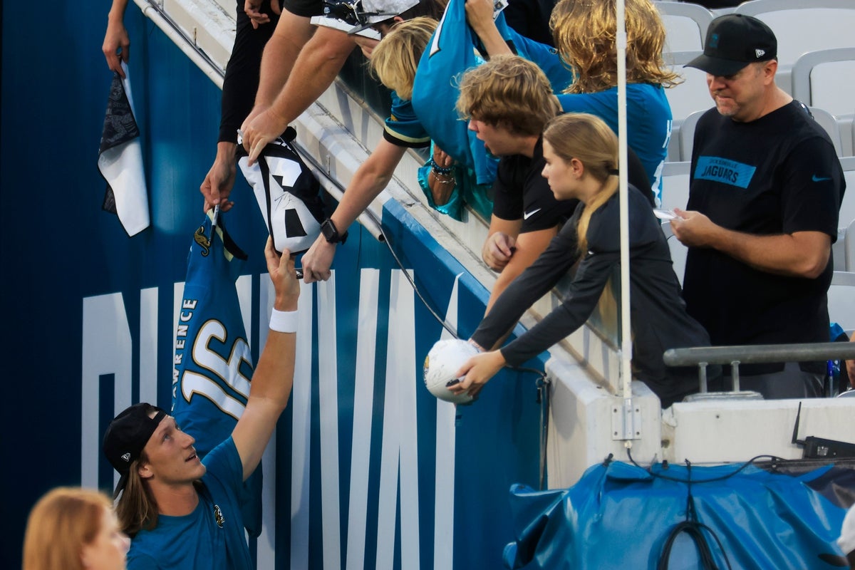 Jacksonville Jaguars quarterback Trevor Lawrence (16) signs autographs before an NFL football matchup at EverBank Stadium, Monday, Oct. 6, 2025, in Jacksonville, Fla. The Jacksonville Jaguars edged the Kansas City Chiefs 31-28. [Corey Perrine/Florida Times-Union]